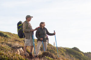 older couple hiking thanks to HRT in Denver