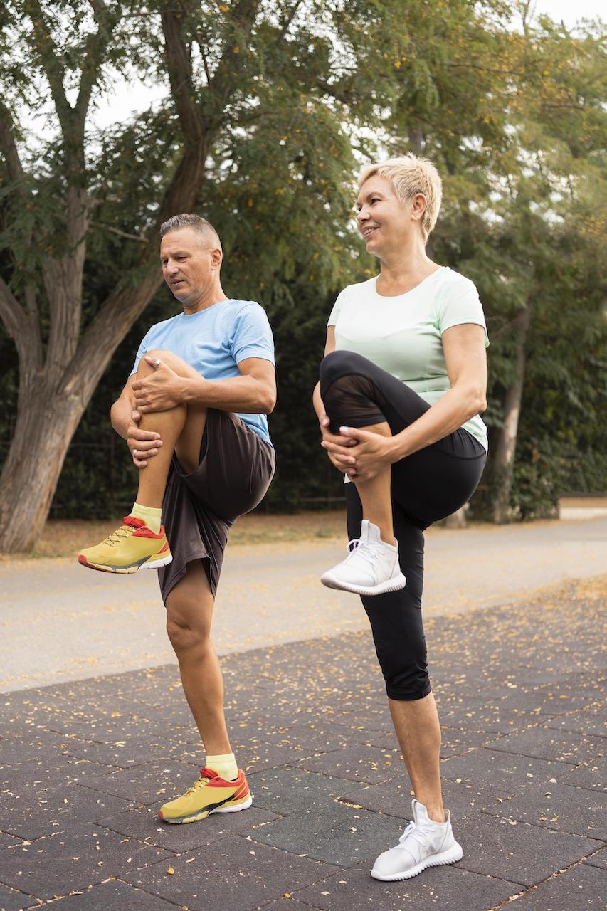 an older couple exercise outdoors because of their medical spa in denver