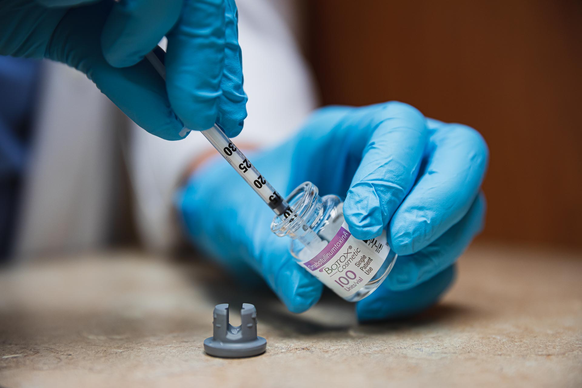 Close up of a nurse prepping Botox for migraines