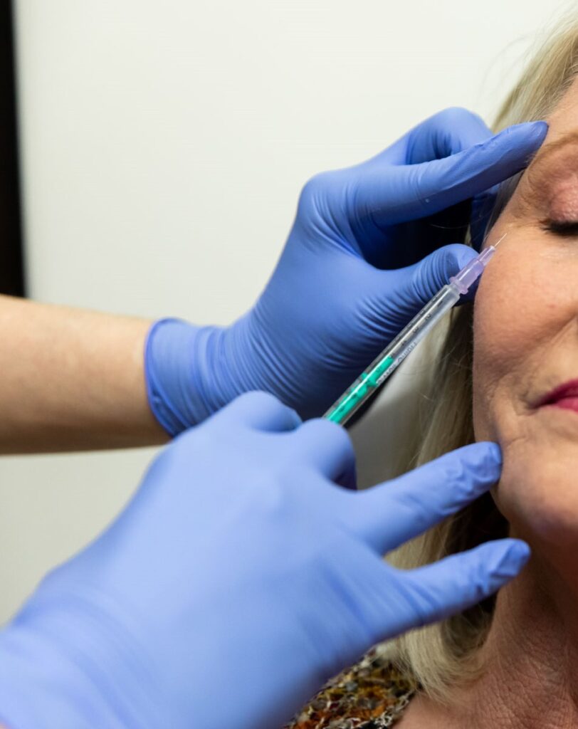 Close up of a woman receiving a wrinkle treatment in Denver